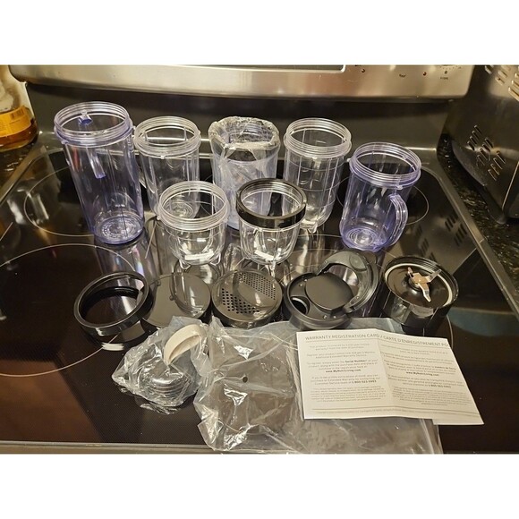 Lot Of 16 Pieces Nutribullet Assorted Cups & Lids / Tops + 1 Blade (Untested) - Picture 1 of 12